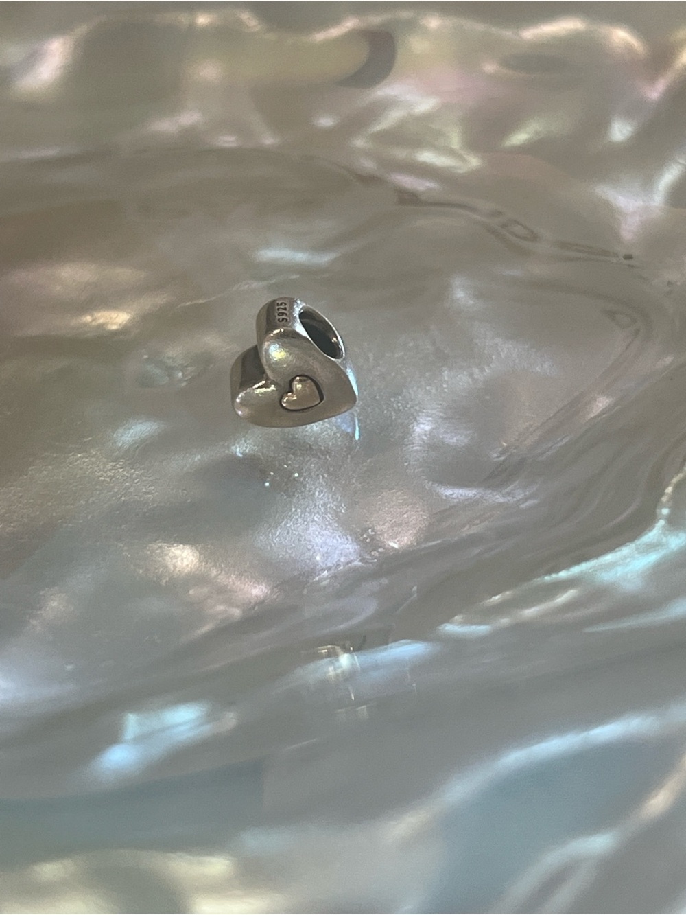 Pandora Silver Heart Charm with Gold Center.  Happy anniversary on the back!